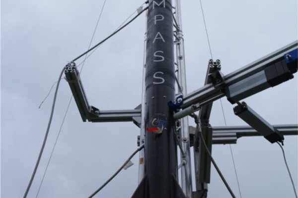 the compass rocket mounted on a launch rail, pointing upwards