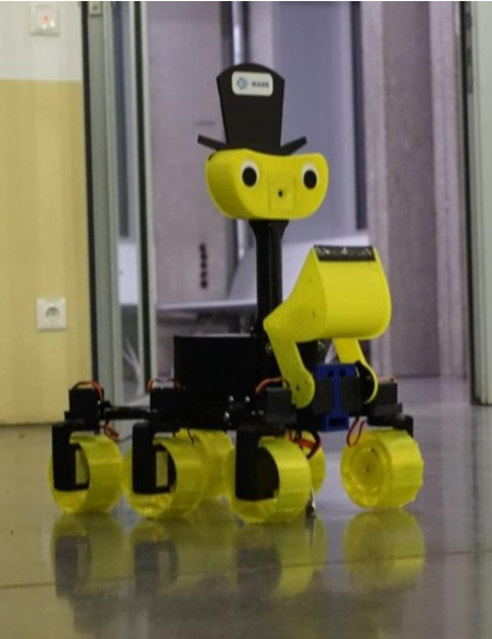 a rover in black and bright yellow with a smiling face painted on, driving inside